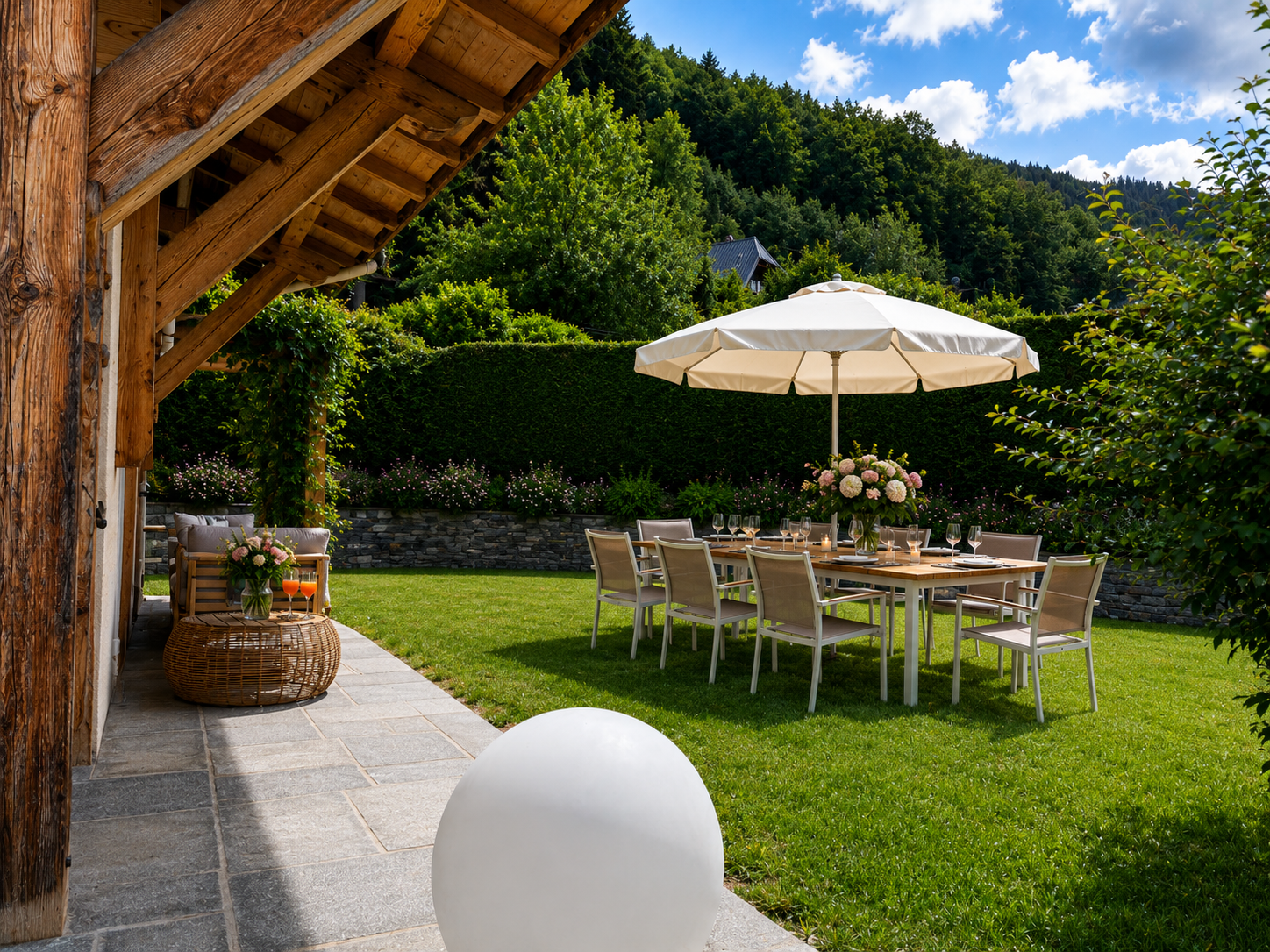 Summer dining in the garden at Fleurs des Roches
